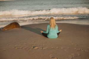 Meditating on the beach to reduce my anxiety and stress levels